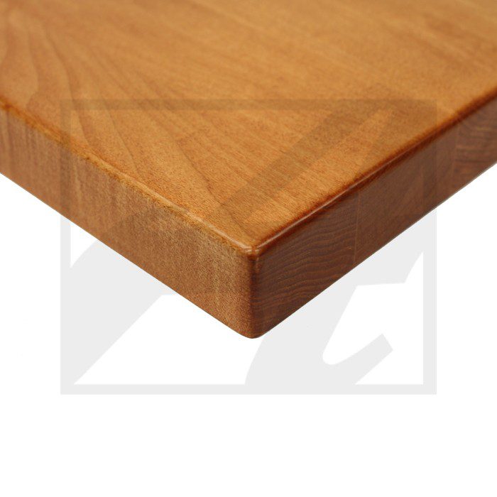 Close-up of a polished wooden table corner with a smooth finish.