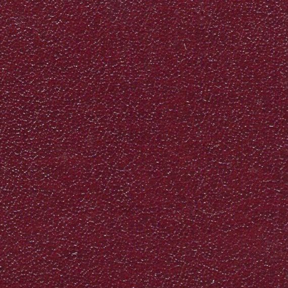 A textured maroon fabric surface.