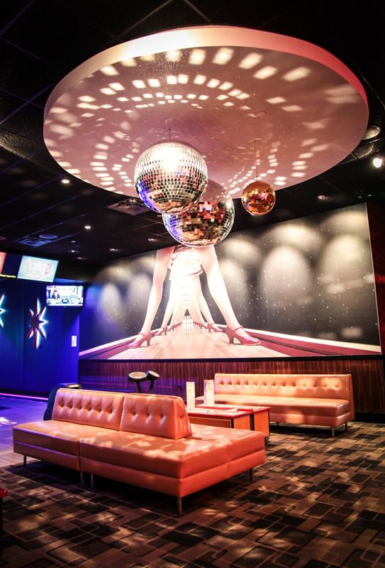 Futuristic lounge with a glowing centerpiece and modern seating.