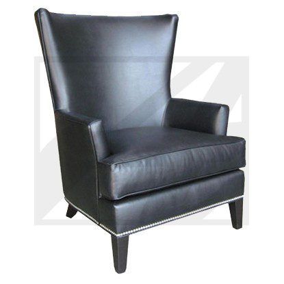 Black leather armchair with wooden legs.