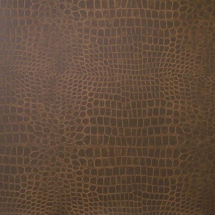Close-up of brown textured leather with a reptile-like pattern.