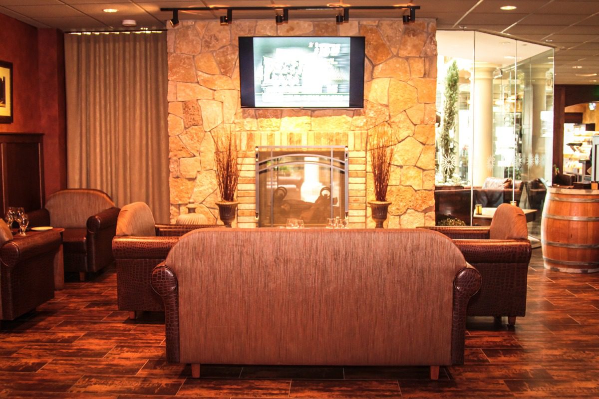 Cozy living room with stone fireplace and comfortable seating.