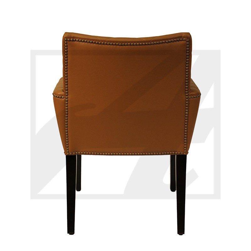 Rear view of a modern brown leather chair with black legs.