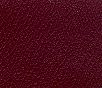 Close-up of textured dark red material with fine grain pattern.