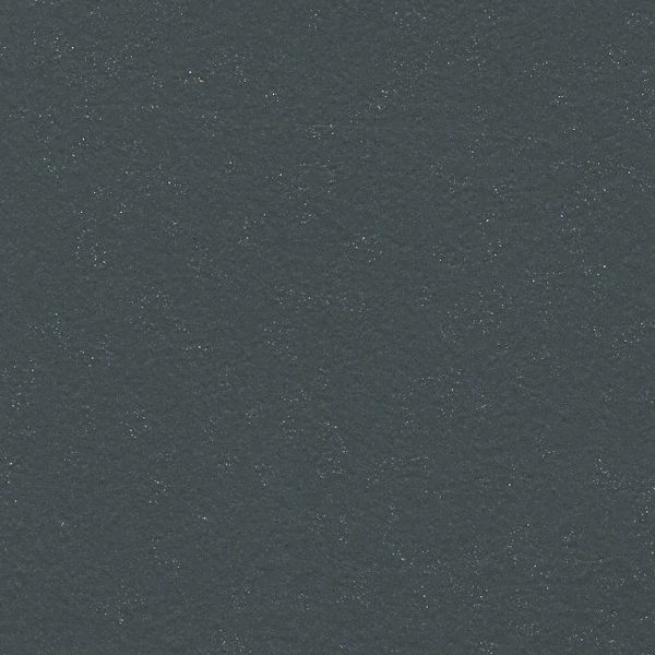 Dark gray textured surface with subtle speckles.