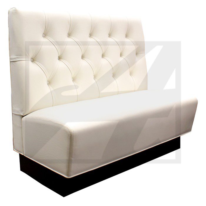 White tufted booth seating with black base.