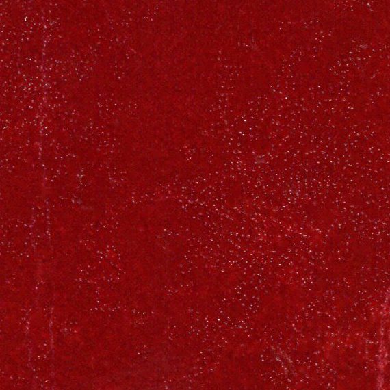 Textured deep red surface with subtle variations.