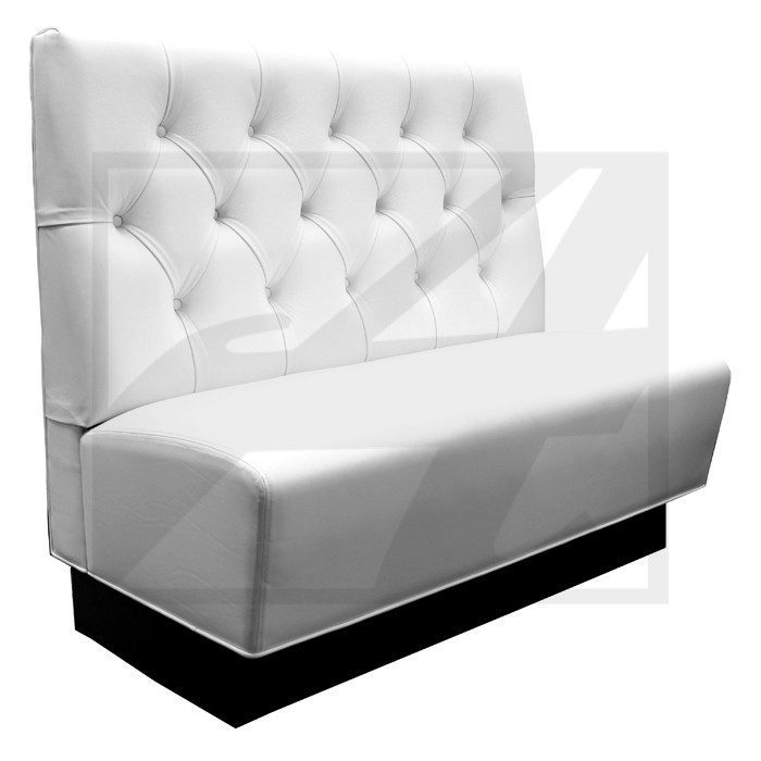 White tufted restaurant booth seating with black base.