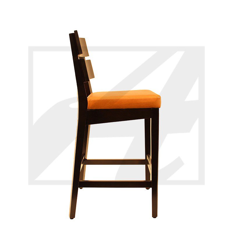 Side view of a wooden bar stool with an orange cushion.