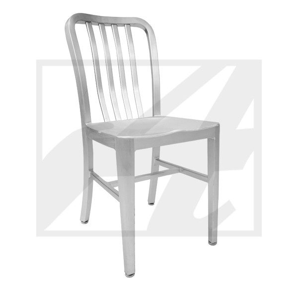 A simple metal chair with a slatted backrest casting a shadow.