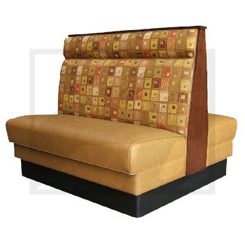 A restaurant booth with patterned upper cushions and tan leather seats.