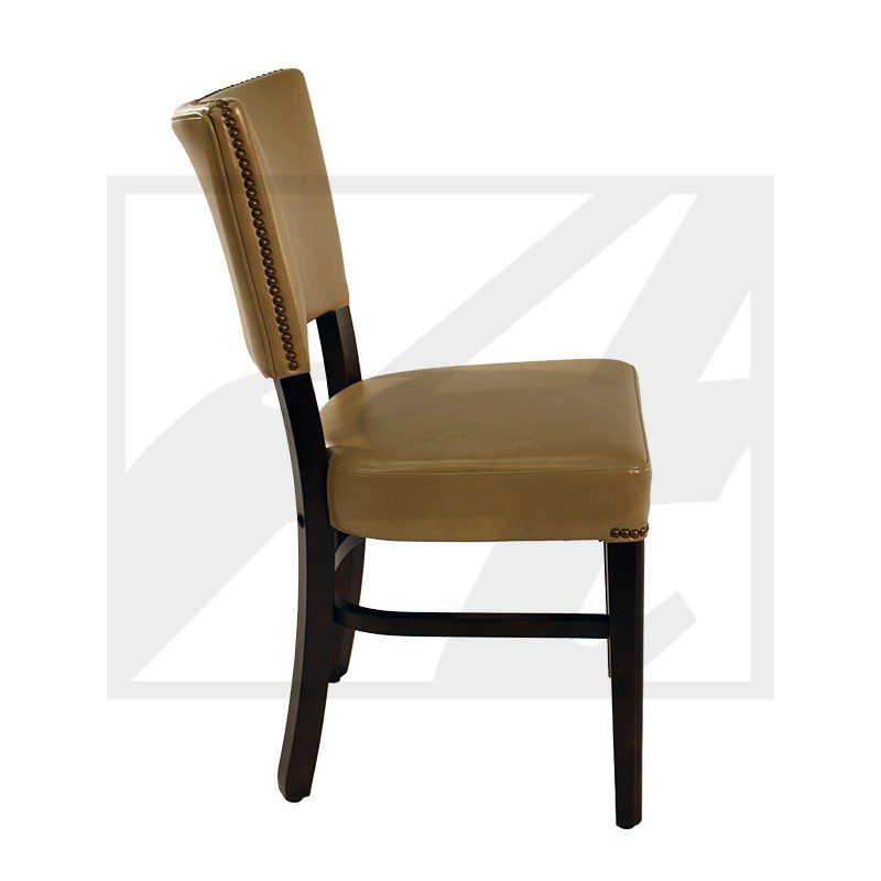 Side view of a brown upholstered dining chair with dark wooden legs.
