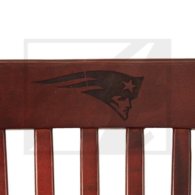 Chair backrest with a stylized panther logo in dark brown.