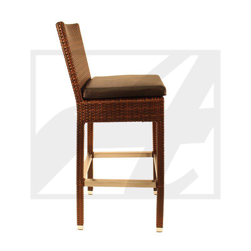 Side view of a woven rattan bar stool with a cushioned seat and wooden legs.
