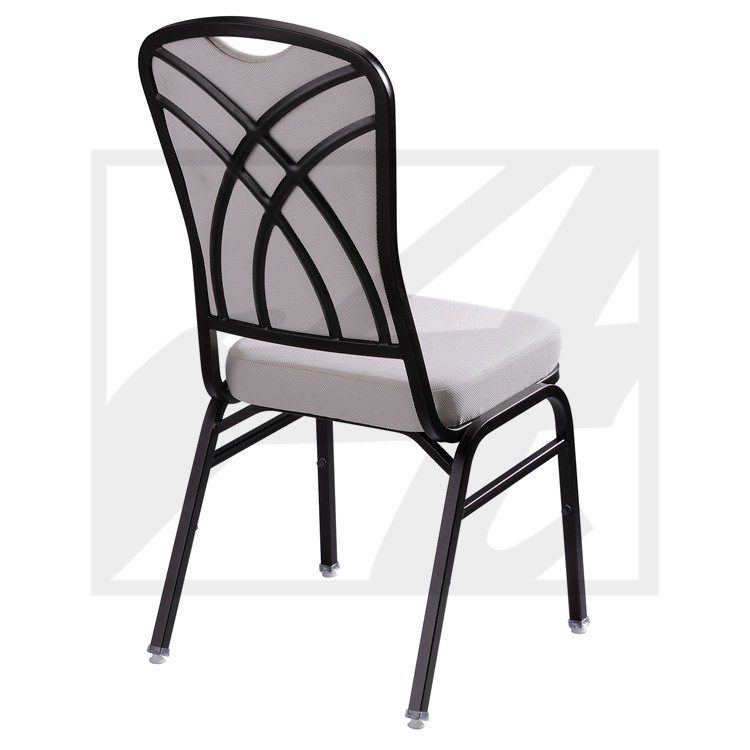 Black metal chair with cushioned seat and decorative backrest.