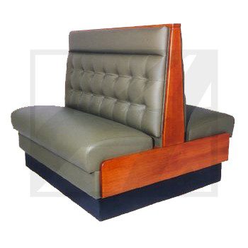 A vintage restaurant booth with tufted gray upholstery and wooden frame.