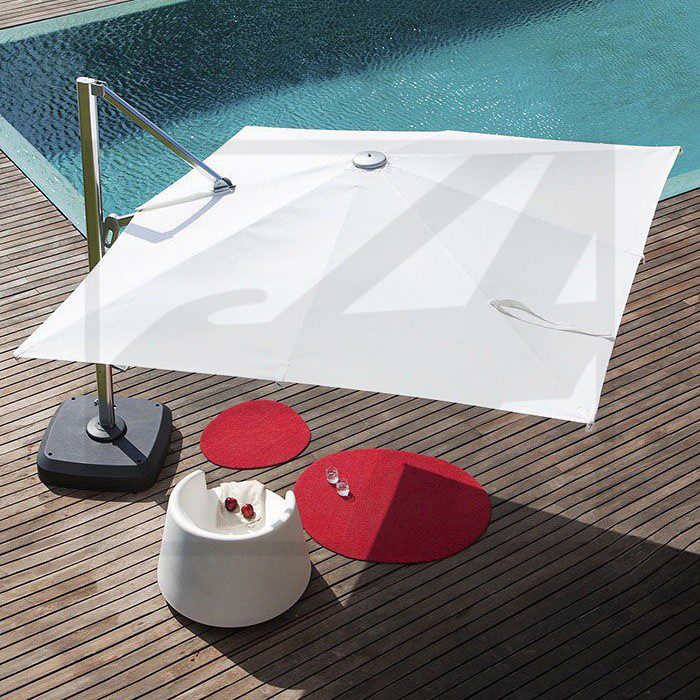 Modern outdoor setup with a white cantilever umbrella and red chairs.