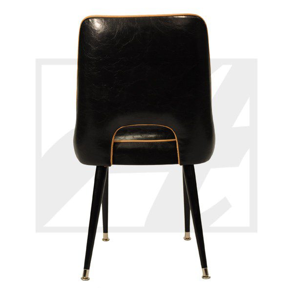Black vintage chair with metal legs and a curved backrest.
