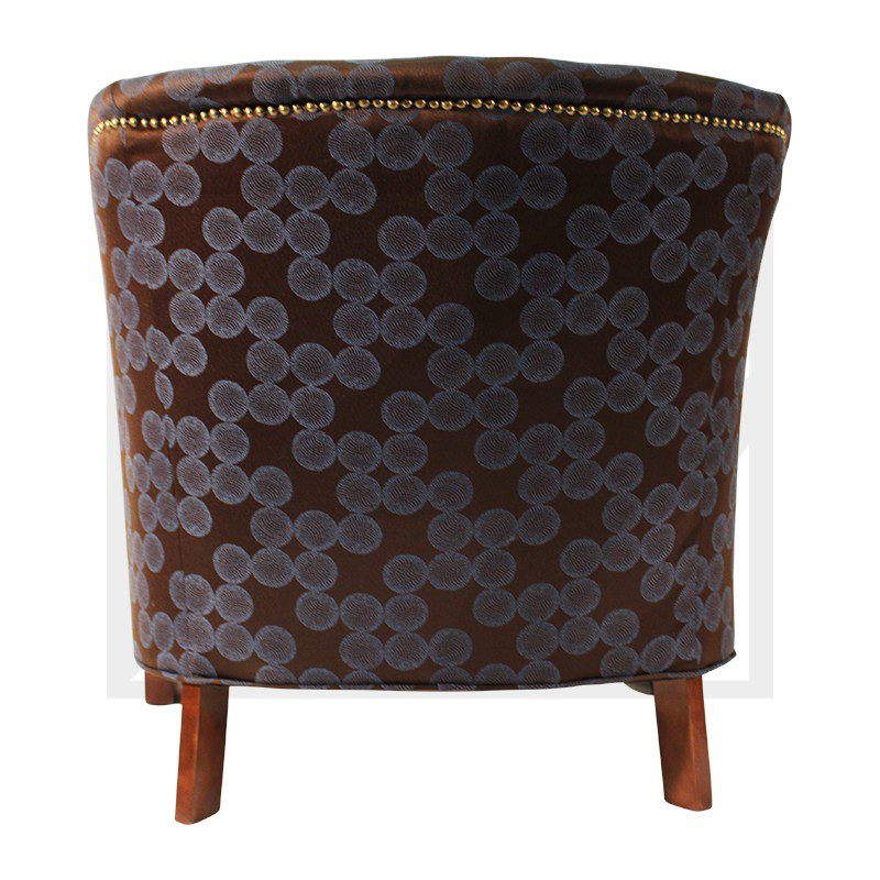 Rear view of a stylish upholstered chair with wooden legs and patterned fabric.