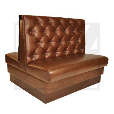 Brown tufted leather booth seat with a modern base.