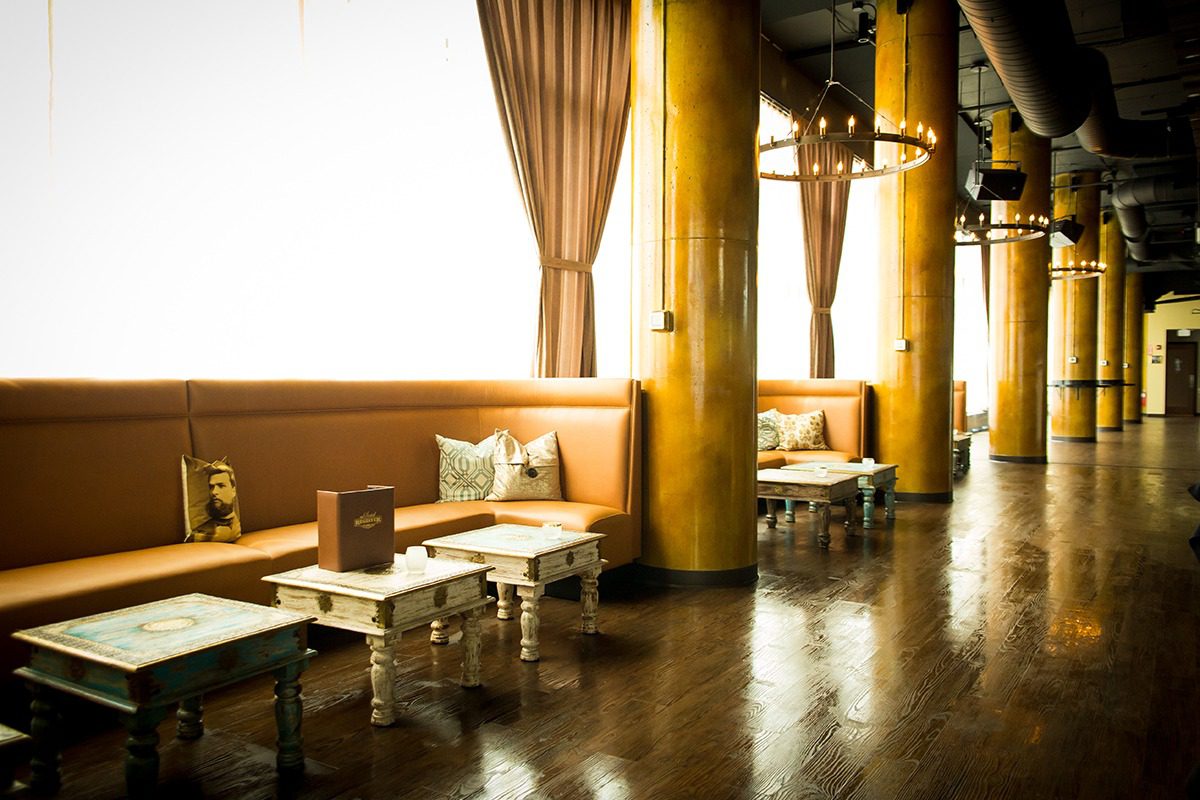 Cozy lounge area with wooden decor and soft lighting.