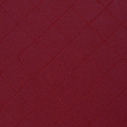 A textured maroon surface with a subtle diamond pattern.