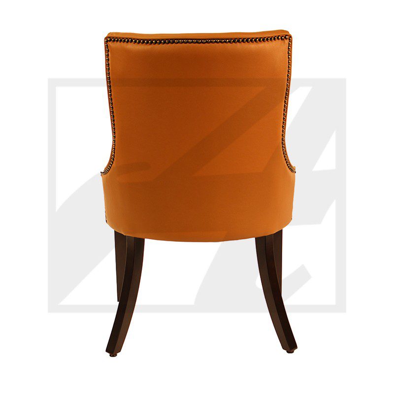 Orange upholstered chair with wooden legs, viewed from the back.