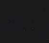 A dark night sky with faint stars and distant celestial objects.