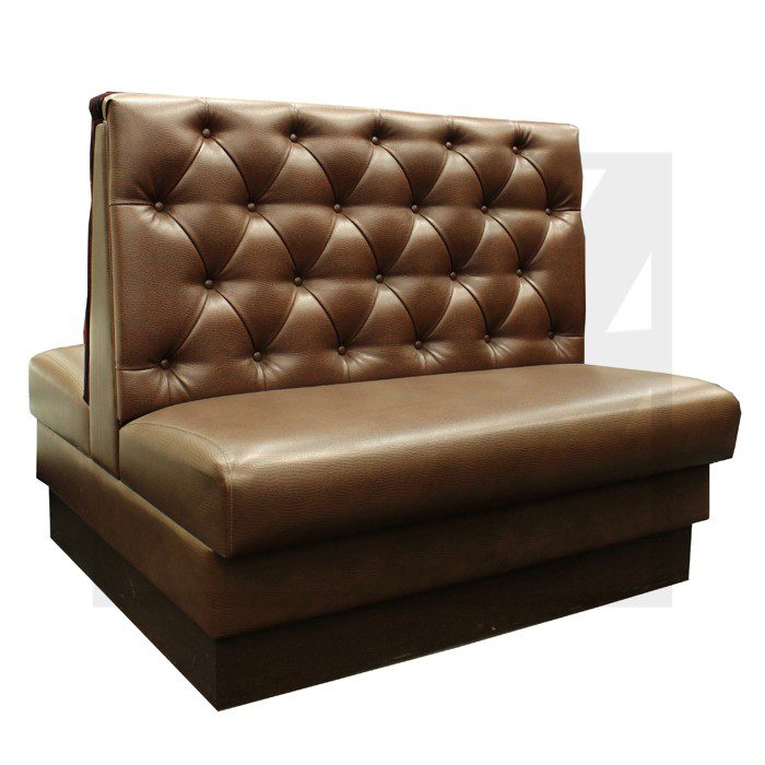 Brown leather tufted booth seating with high backrest.