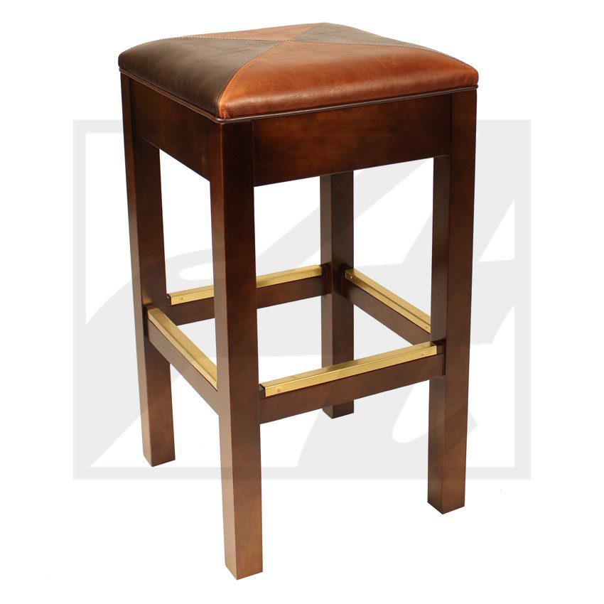 Wooden bar stool with cushioned brown leather seat and brass footrest.