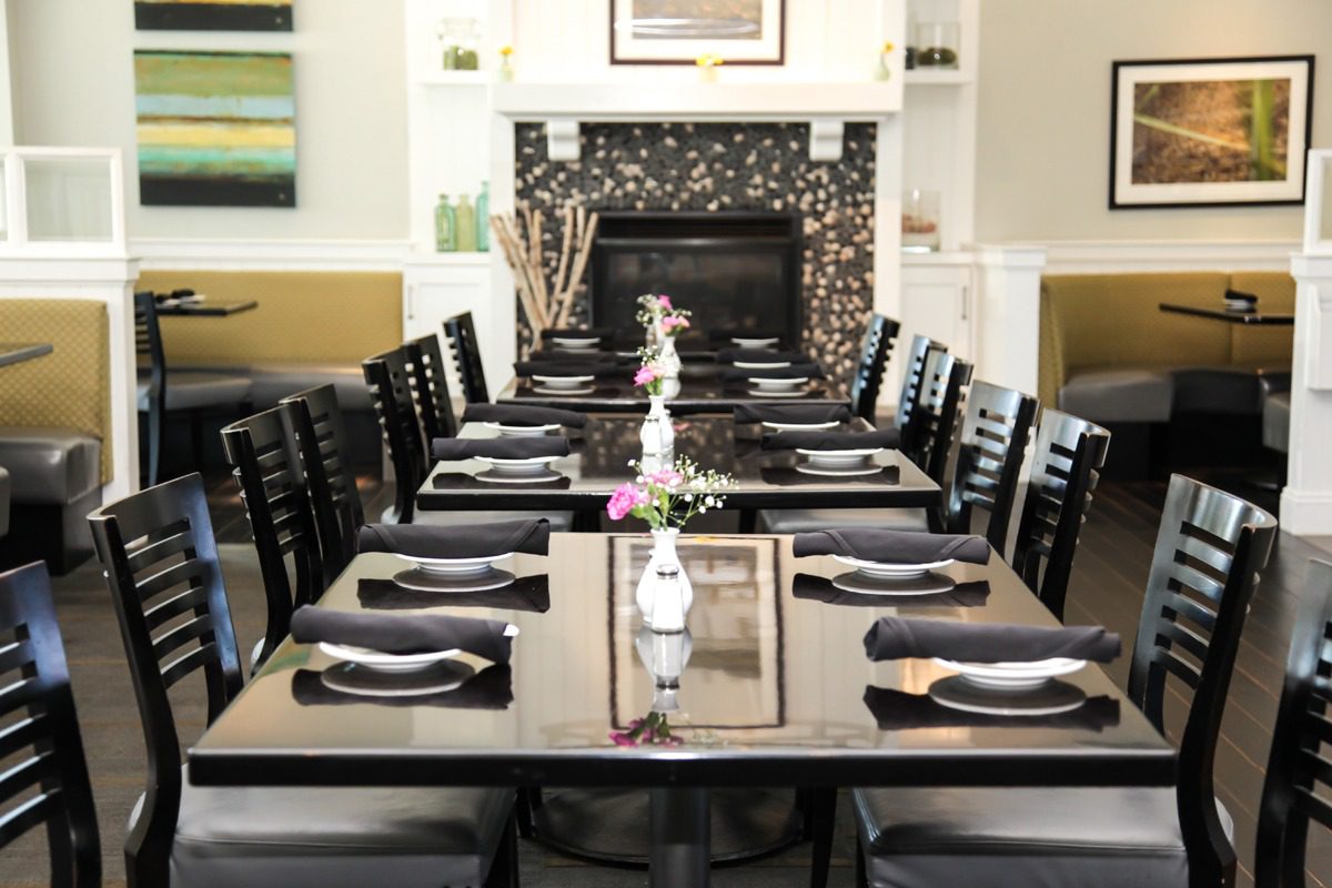 Elegant dining table set for a formal meal in a cozy room.