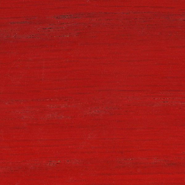 A textured red surface with subtle variations in tone.