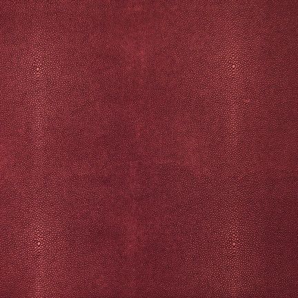Close-up of textured maroon fabric with subtle variations.