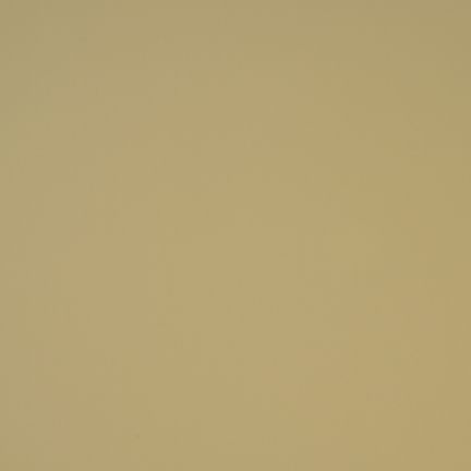 A plain beige wall with smooth texture.