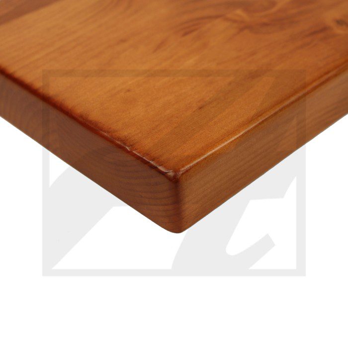 Close-up of a polished wooden tabletop corner.