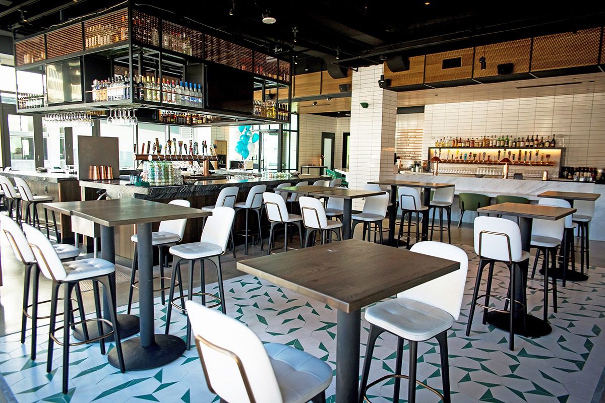 Modern café with stylish seating and warm lighting.