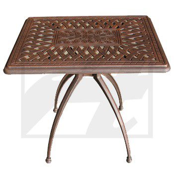 Intricately designed metal table with a square top and curved legs.