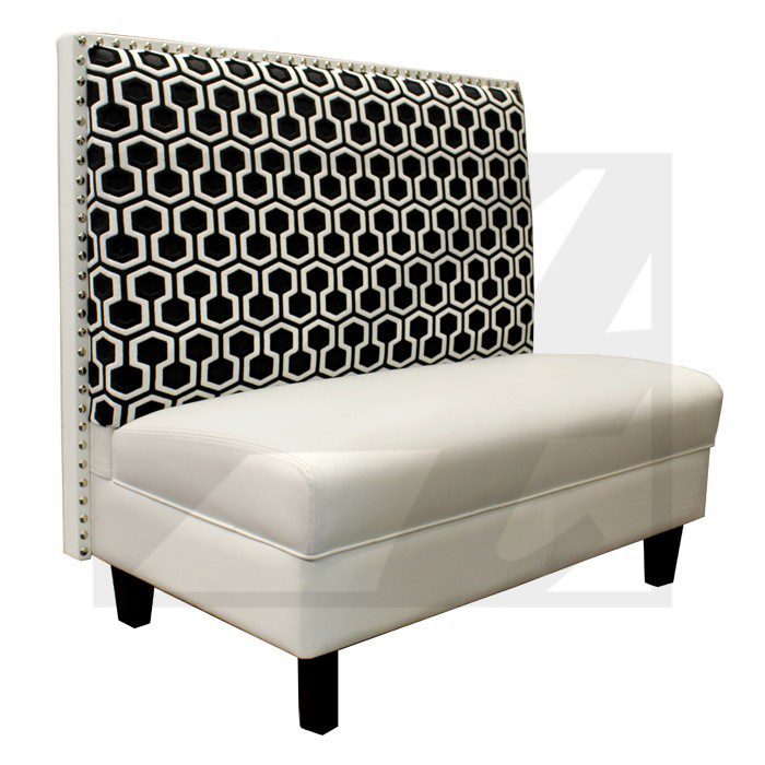 Upholstered bench with patterned backrest and nailhead trim.