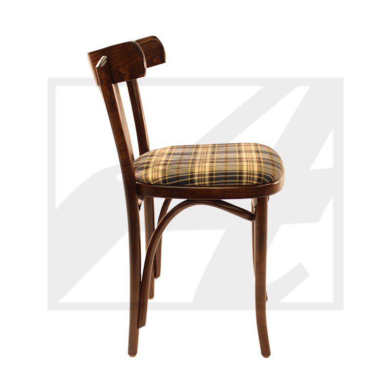Side view of a wooden chair with plaid cushioned seat and backrest.