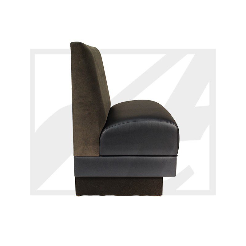 Side view of a modern, cushioned chair with a high backrest and dark upholstery.