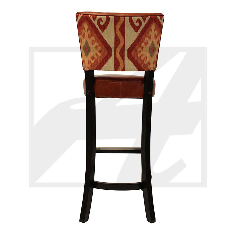 Wooden bar stool with patterned fabric backrest and cushioned seat.