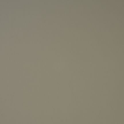 A plain, solid beige surface.