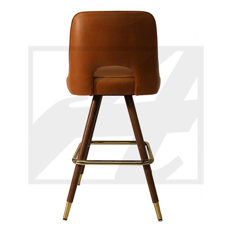 Modern brown leather chair with wooden legs and brass accents.