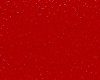 Close-up of a red surface with water droplets scattered.