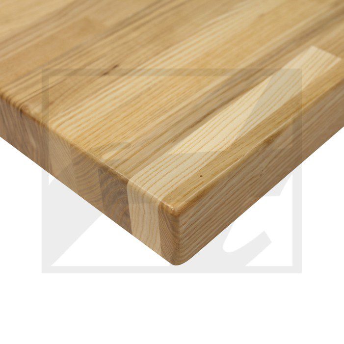 Close-up of a wooden butcher block countertop corner.