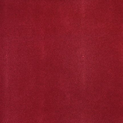 Close-up of a rich red velvet fabric with soft texture.