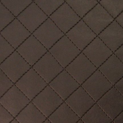 Close-up of dark brown quilted fabric with diamond pattern.