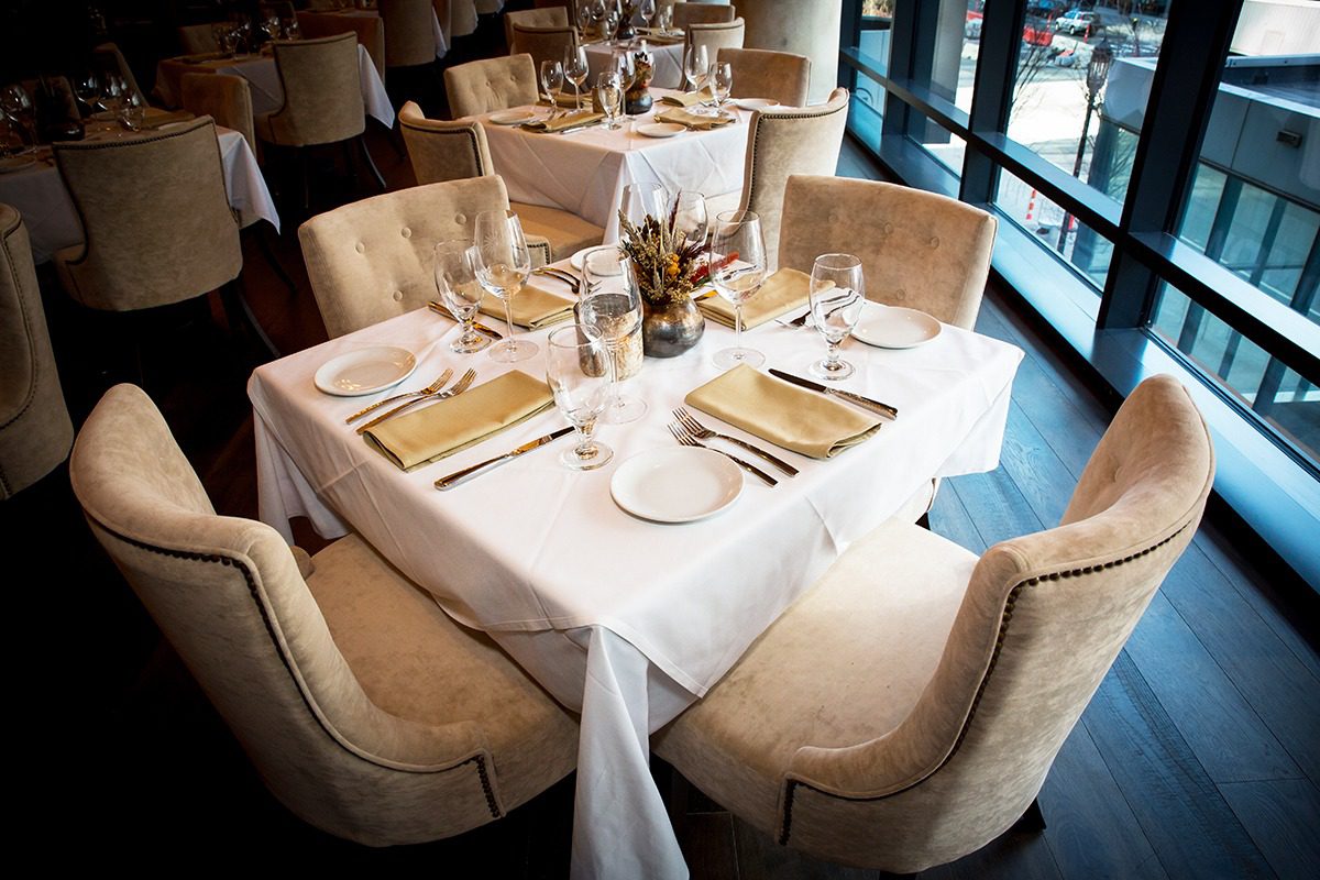Elegant dining table set for a meal in a cozy restaurant.