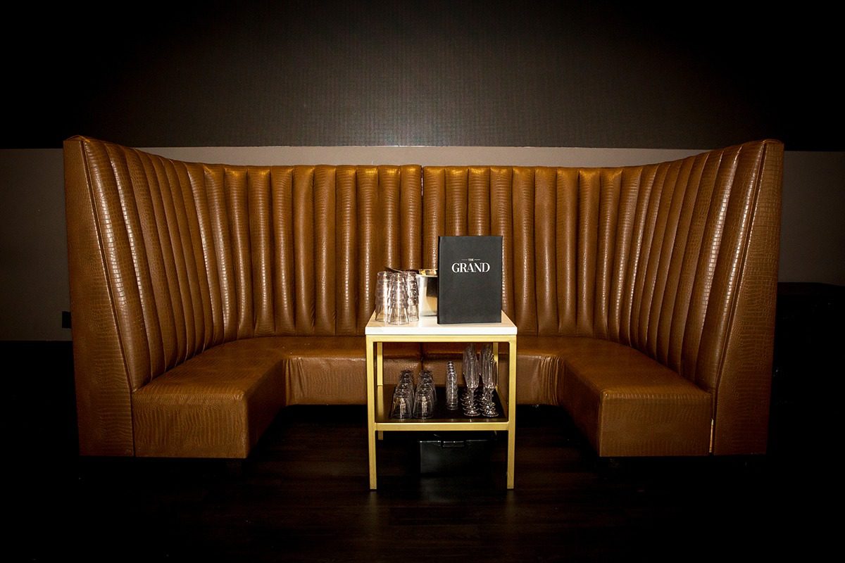 Elegant lounge seating with a small table and drinks setup.