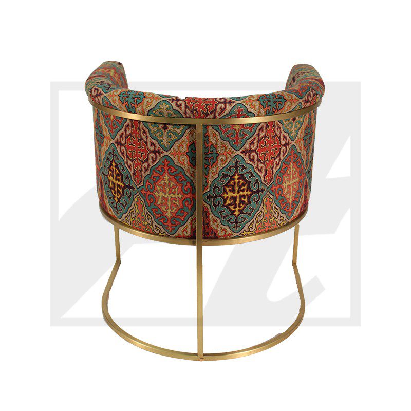 Colorful tapestry basket with gold metal stand.